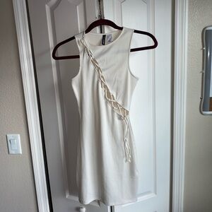 Like New Divided, H&M ribbed Cream Lace-Up Mini Dress is a women’s Size XS.
